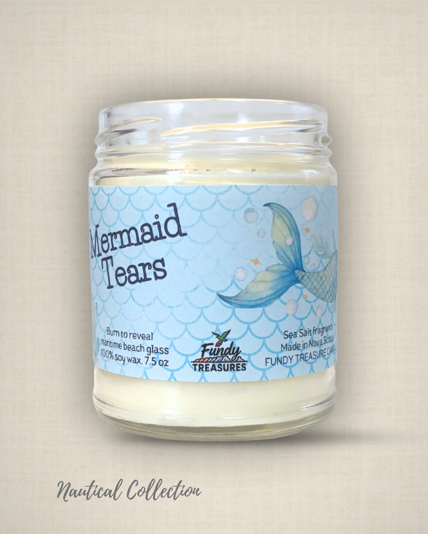 Coastal‑inspired Mermaid Tears candle with ocean‑themed design